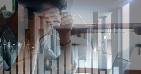 Image of financial data processing and statistics over worried caucasian man using laptop