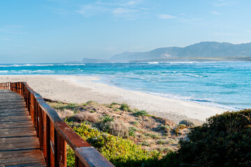 The famous white beach of La Pelosa in Italy. Stintino, province of Sassari, Italy, Europe. Paradise vacation in Europe. Vacation destination, turquoise sea.