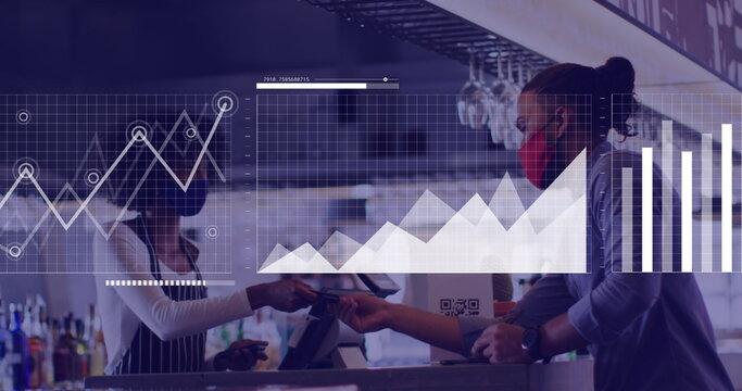 Image of financial data over afriocan american women in face mask in cafe - Powered by Adobe