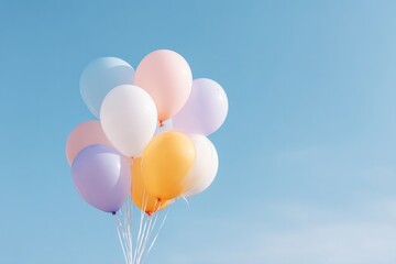bright and colorful balloons against clear blue sky symbolizing joy and celebration with ample copy space