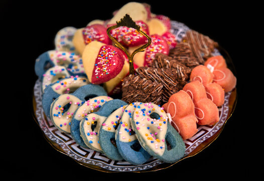 indian sweets mix, baked cookies assortment, Pakistani Indian Islamic weddings, various pastry colorful in a tray plate with gold decorations, assorted fancy cookies,