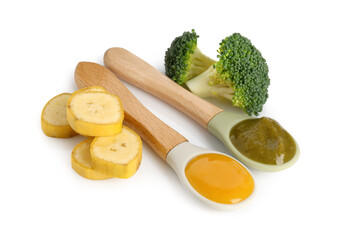 Baby food. Spoons with tasty puree, broccoli and banana on white background