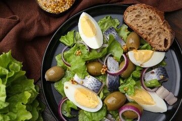 Delicious salad with herring, egg, mustard and vegetables on wooden table, flat lay