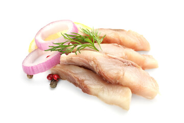 Pieces of delicious herring with peppercorns, onions, lemon slice and dill isolated on white