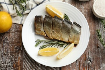 Smoked herring and spices on wooden table, flat lay