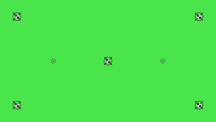 Green screen template with tracking marks. Chromakey technique. Studio background. Video technology to add VFX visual effects.