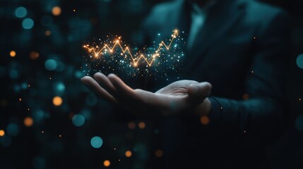 A hand holds a glowing graph, symbolizing growth and data analysis.