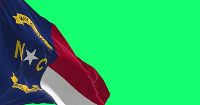 North Carolina state flag waving isolated on a green background