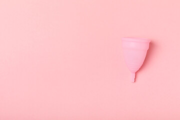 Menstrual cup on a bright background. Sanitary napkins, tampons and menstrual cup.Concept of...