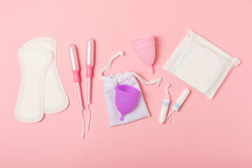 Menstrual cup on a bright background. Sanitary napkins, tampons and menstrual cup.Concept of...