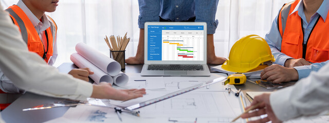 Project planning software for brisk business project management on the computer screen showing...