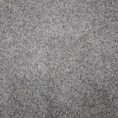 High resolution close up of grey wool felt texture showing soft fibrous surface ideal for textile, fabric, craft, and background design in modern creative projects.
