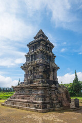 Fototapeta premium Setyaki Temple in Dieng, Central Java, Indonesia with blue sky background. Relics of Hindu temple. For graphic design, 3D rendering and banner background