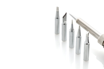 Set of soldering iron tips isolated on a white background, close-up.