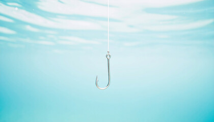 Fishing hook on string underwater. Clear sea or ocean water background.