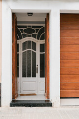 Elegant White Doorway with Ornate Glass and Wooden Paneling