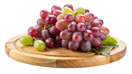 Fresh juicy red grapes with green leaves sitting on a wooden board