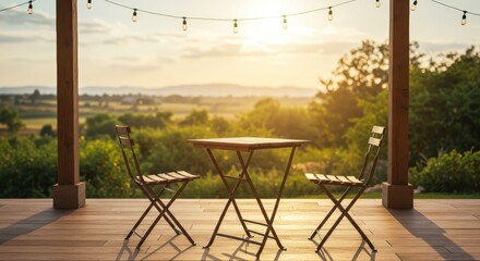 Fototapeta premium Empty wooden table with two chairs on a covered patio at sunset and string lights above, relaxing concept for outdoor dining or quiet contemplation