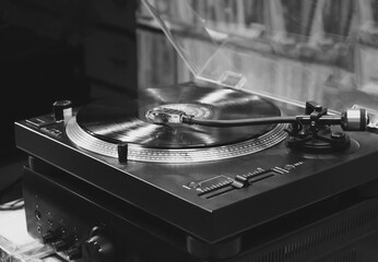 Black and White Modern Turntable with Vinyl Record in Studio Environment