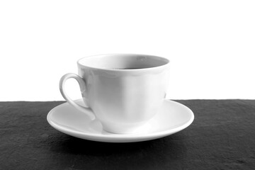 A white cup of tea stands on a white background.	