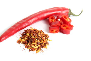 Fresh red hot pepper lies on a white background.