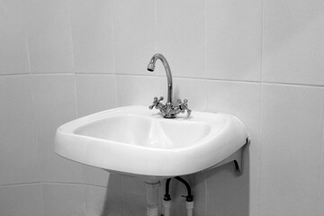 Sink with black and white faucet.