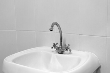 Sink with black and white faucet.