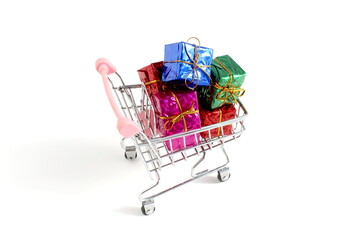 There is a shopping cart with a bunch of gifts on a white background.
