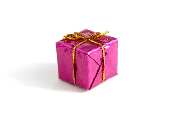 There is a small gift box with a bow on a white background.