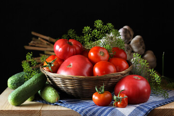 Fresh tomatoes, cucumbers, garlic and dill creating vibrant still life on rustic table