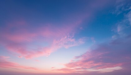 Obraz premium beautiful twilight pink sunset sky in soft and smooth clouds with pastel color background