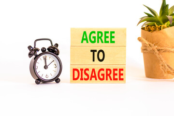 Agree to disagree symbol. Concept words Agree to disagree on beautiful wooden block. Black alarm...