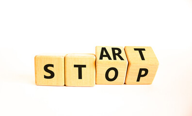 Start or stop symbol. Concept words Start or Stop on beautiful wooden block. Beautiful white table...