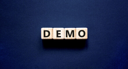 Demo symbol. Concept word Demo on beautiful wooden blocks. Beautiful black table black background....