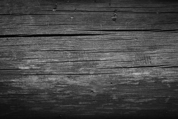 Naklejka premium Wooden surface with cracks in dark gray color. Texture of gray wooden surface.