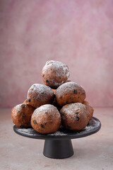 Traditional Dutch oliebollen on a pink background