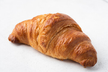 French croissant isolated on white, closeup view