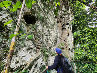 Woman looking at the ancient burial site of The Sugpan tribe in Danum Valley Lahad Datu