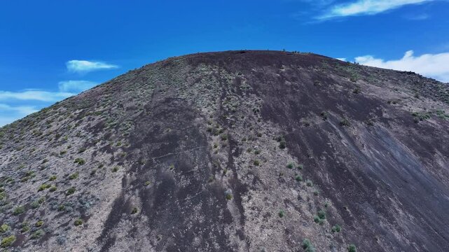 Aerial desert volcanic cinder cone mountains St George Utah slide. Southwestern desert. Volcano cinder cone mountains in desert landscape. Geological landscape wind, weather and water carved erosion.