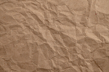 Crumpled brown kraft paper texture background
