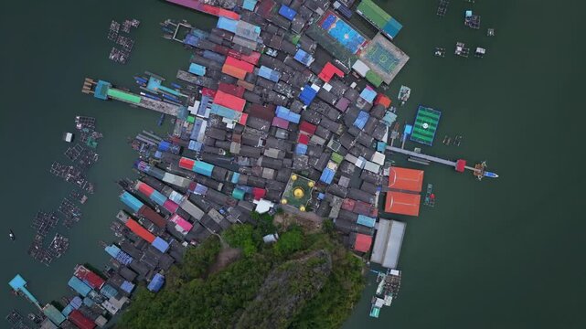 Floating village of Koh Panyi in Phang Nga Bay captured from above, Thailand. Aerial drone video