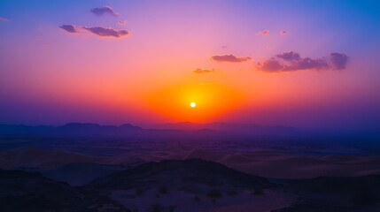 Obraz premium Stunning sunrise over a desert mountain range.
