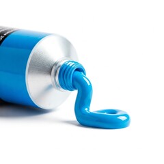 Close-up of vibrant blue acrylic paint luxuriously squeezed from a white tube on a pure white background. Premium, elegant, and visually striking.
