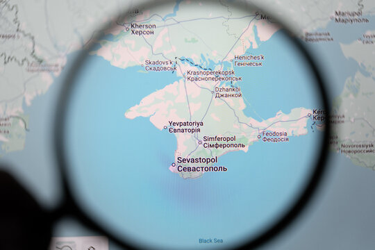 Map of Crimea seen through magnifying glass on Google maps. Crimea is a Ukrainian territory currently occupied by Russia, highlighting geopolitical tension