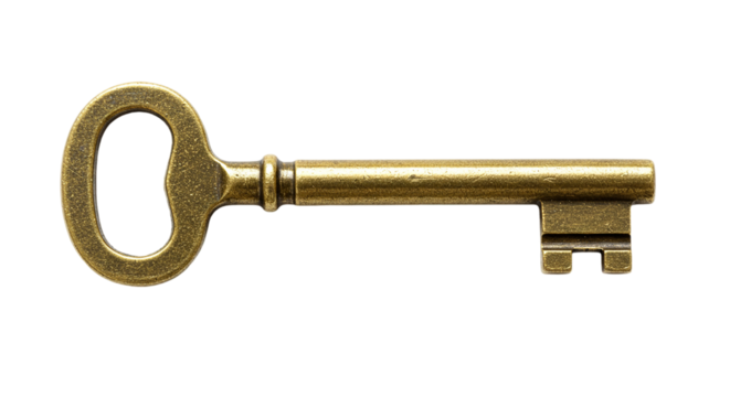 A close up shot of an antique brass key isolated on a black background in a horizontal composition