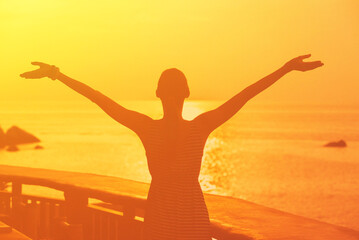 Fototapeta premium Carefree Happy Woman Enjoying Nature sunrise. Freedom concept. 