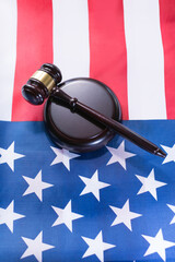 Gavel and base resting on American flag