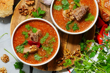 Traditional Georgian soup kharcho with walnuts.top veiw