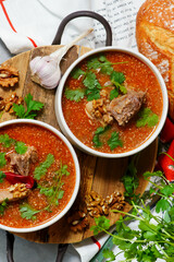 Traditional Georgian soup kharcho with walnuts.top veiw