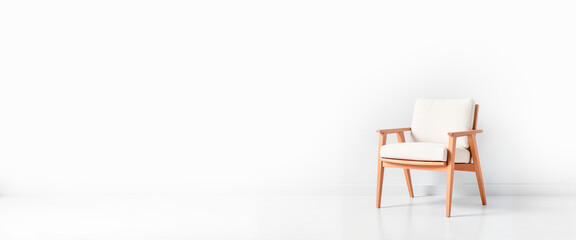 Sleek contemporary chair against pure white wall, modern minimalism